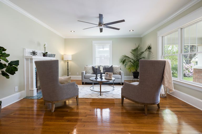 A beautifully designed minimalist living room showcasing modern furniture and natural light.