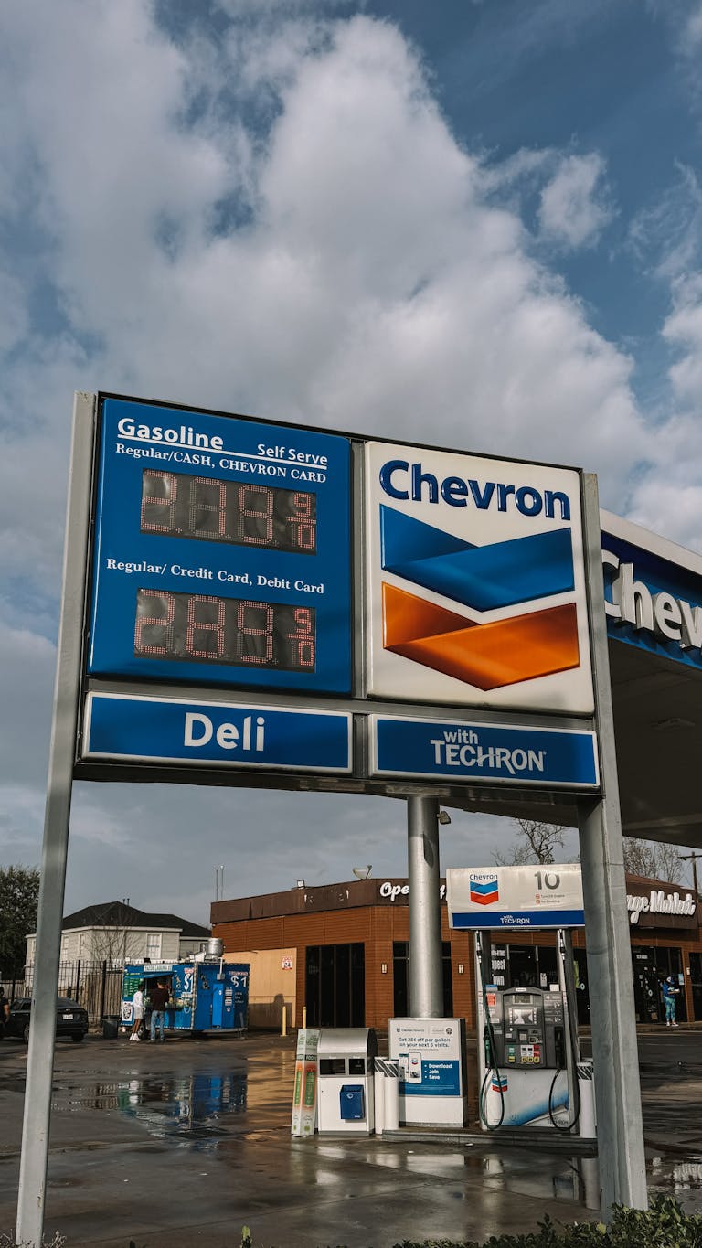 Chevron gas station in Houston, Texas with clear blue skies and price display.