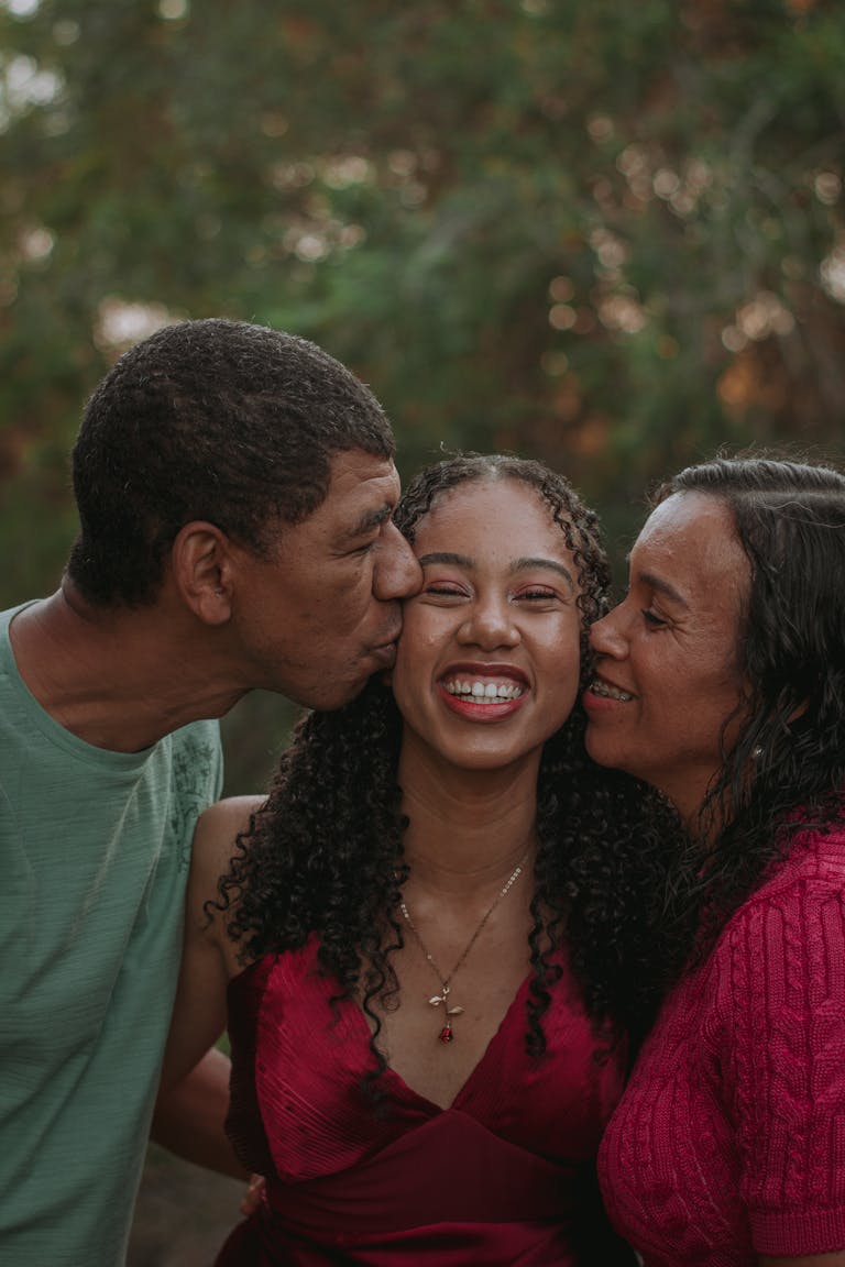 Smiling family enjoying a moment of happiness and togetherness outside.