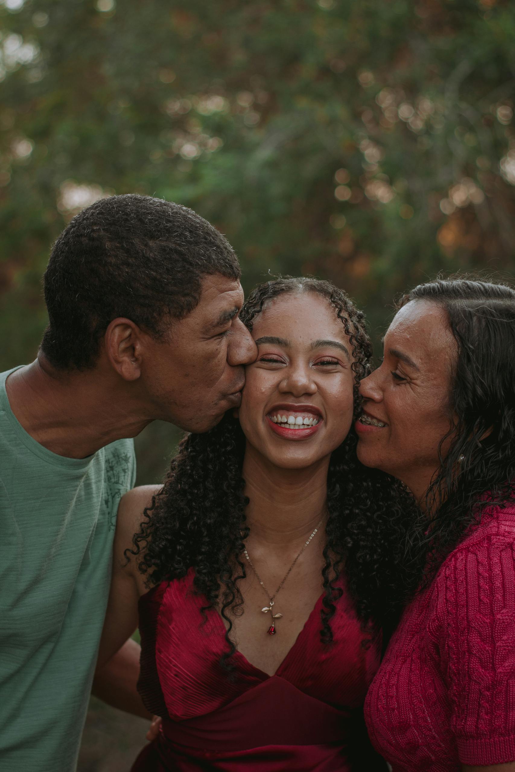 Smiling family enjoying a moment of happiness and togetherness outside.