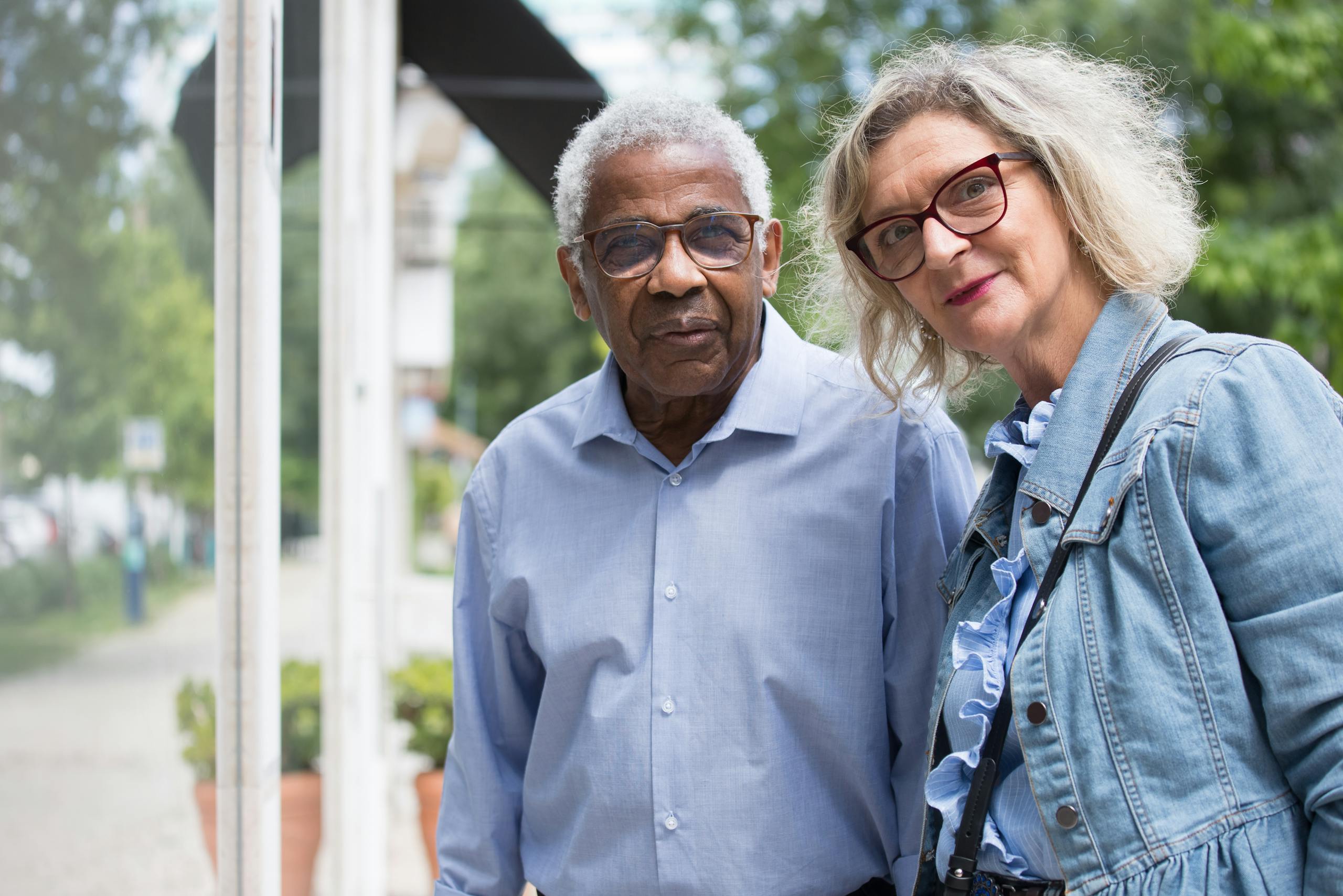 Charming senior couple spending time together in a park in Portugal.
