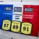 Close-up of a vintage gas pump station showing fuel prices and octane ratings in Los Angeles.