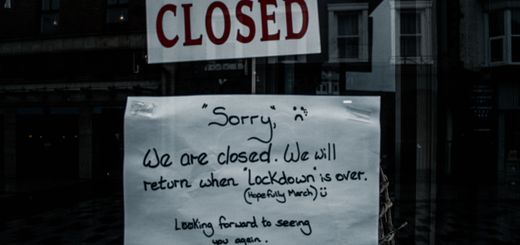A shop window in Darlington, England displays a closed sign due to lockdown.