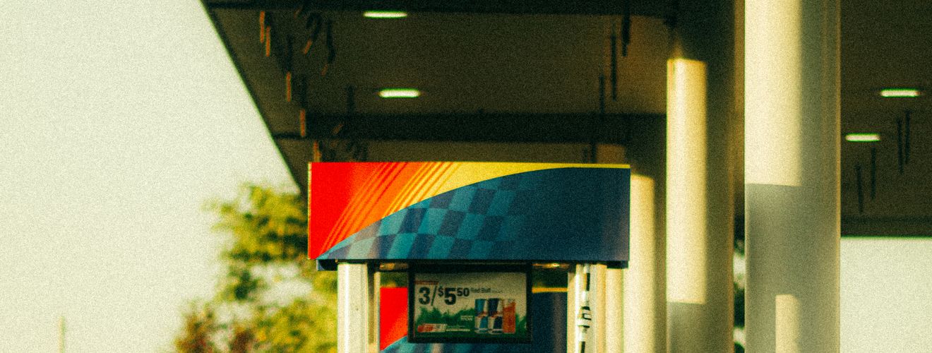 A vibrant Sunoco gas station pump captured at sunset with warm lighting and modern design.