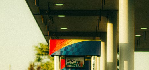 A vibrant Sunoco gas station pump captured at sunset with warm lighting and modern design.