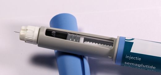 Detailed view of a semaglutide injection pen, commonly used for diabetes treatment, on a plain background.