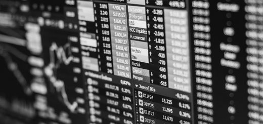 Monochrome image of stock market data on a screen, depicting financial information and trends.